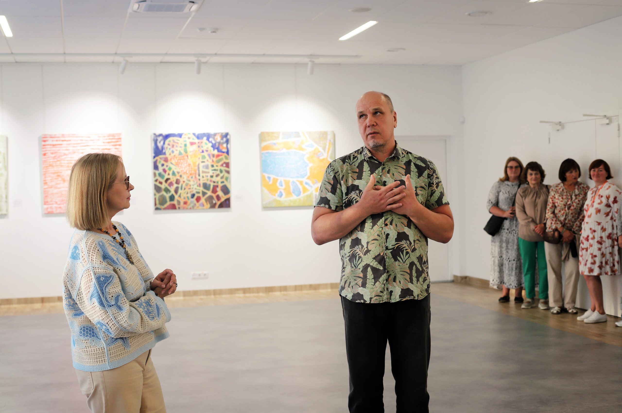 Ugnius Motiejūnas speaking at the exhibition opening